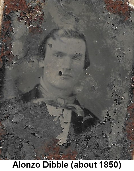 Badly-corroded black and white tintype portrait photograph of a young man with slicked-back hair and floppy bow tie